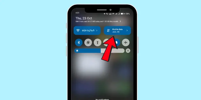 How to enable mobile data on an Android phone, showing the quick settings panel with the mobile data option highlighted.